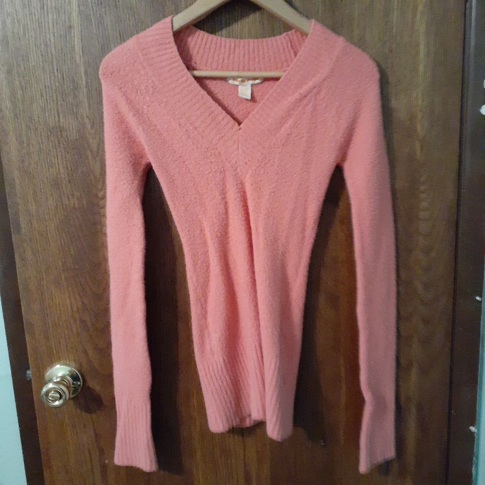 Pink fuzzy sweater.